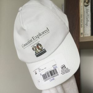 White cap with 20th anniversary logo